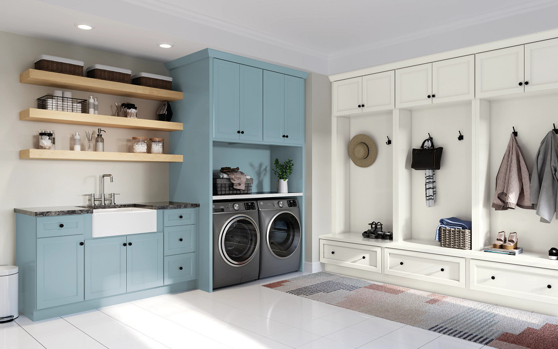 Combined laundry and mudroom: a teal base run with an apron-front sink and a dark speckled counter under open wood shelves, facing a white three-bay locker unit with a drawer bench